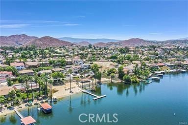 aerial view featuring a water and mountain view