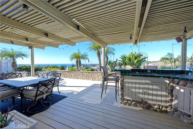 wooden terrace with an outdoor wet bar