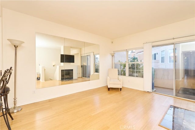 living area with hardwood / wood-style flooring