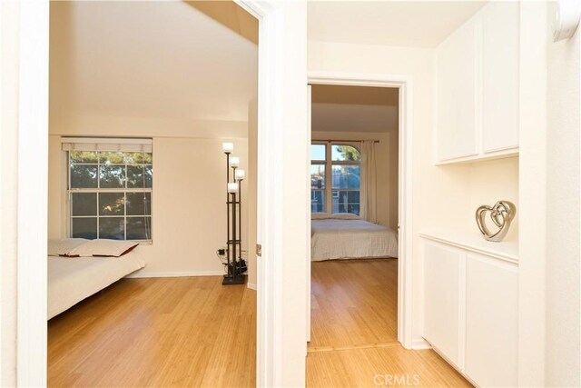 hall with light hardwood / wood-style floors