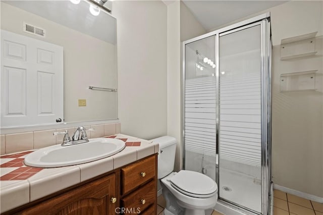 bathroom featuring vanity, an enclosed shower, tile patterned floors, and toilet