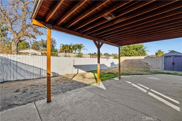 view of patio / terrace featuring a storage shed