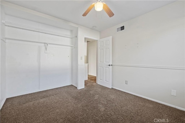 unfurnished bedroom with carpet flooring, ceiling fan, and a closet