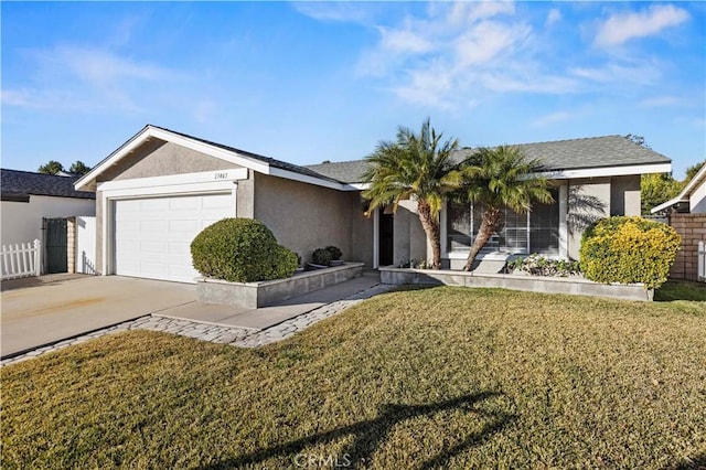 single story home with a garage and a front yard