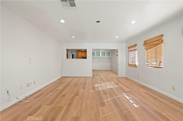 empty room with light hardwood / wood-style floors