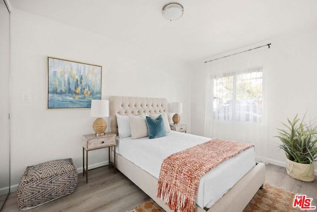 bedroom featuring hardwood / wood-style floors