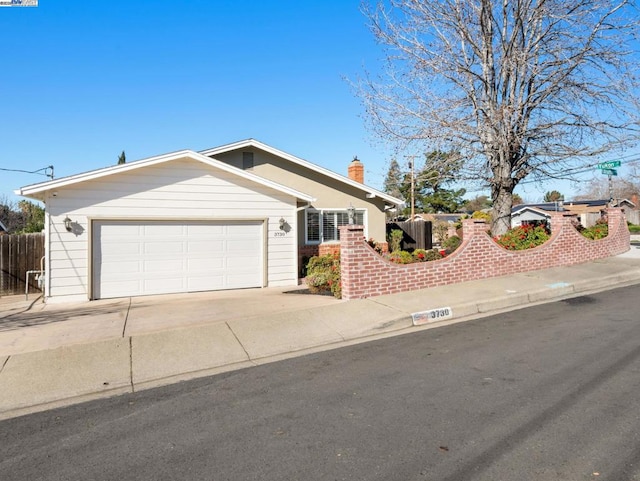 ranch-style house featuring a garage