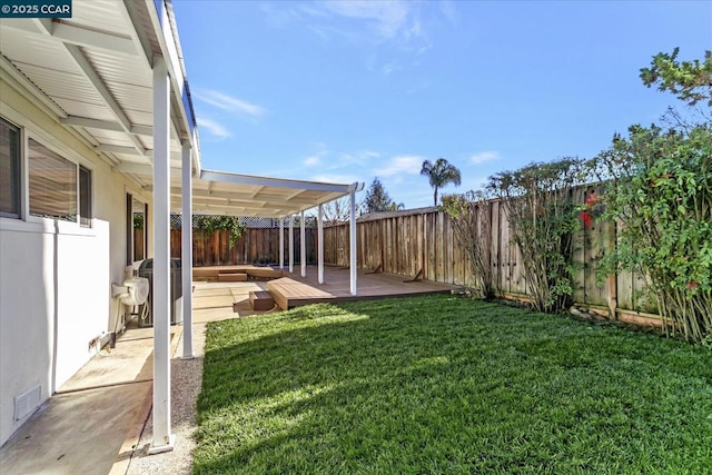 view of yard featuring a wooden deck