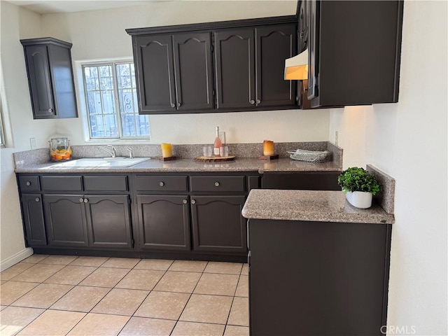 kitchen with light tile patterned flooring and sink