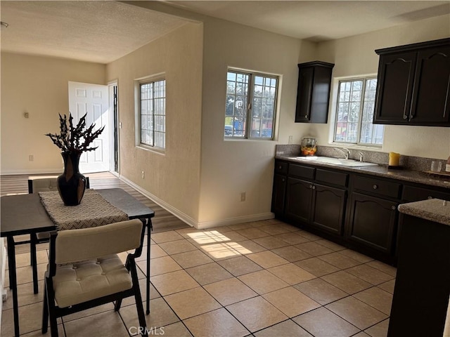 kitchen featuring sink and light tile patterned floors