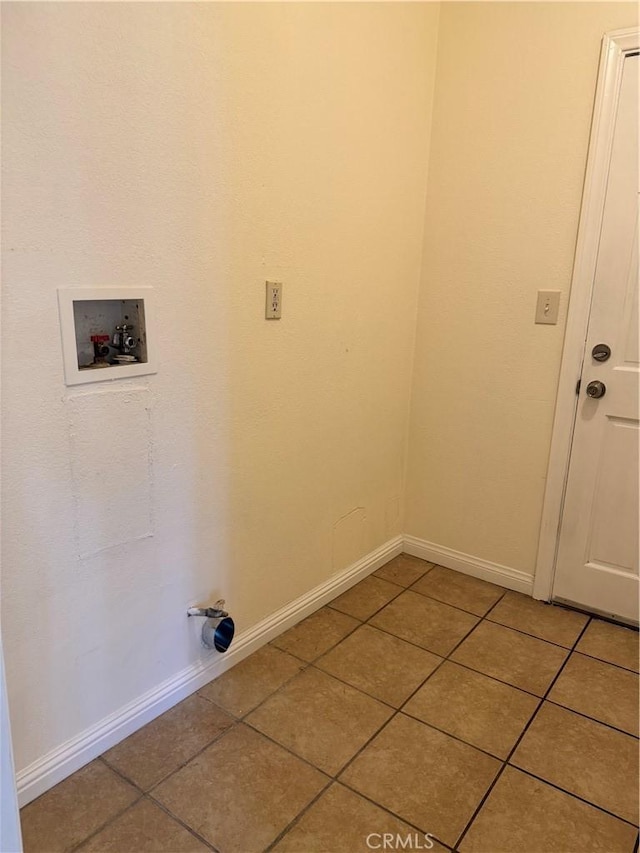 laundry room featuring tile patterned floors and washer hookup