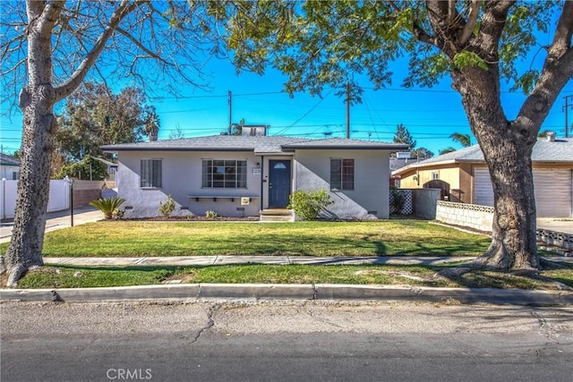 ranch-style home with a front yard