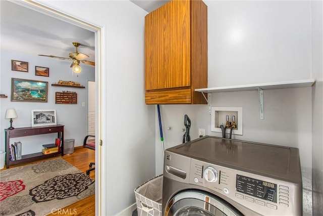 washroom with ceiling fan, cabinets, washer / clothes dryer, and hardwood / wood-style flooring