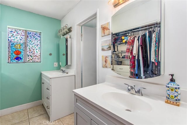 bathroom with tile patterned floors and vanity