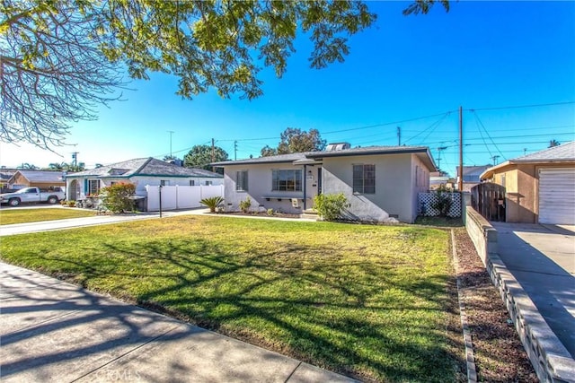 single story home featuring a front lawn