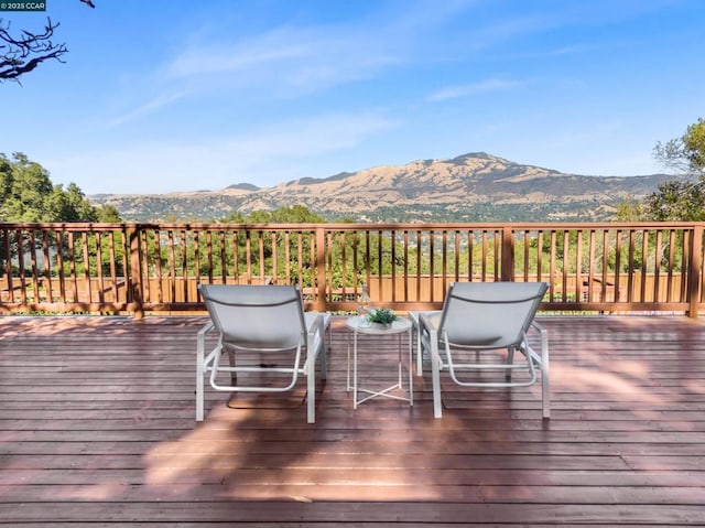 wooden terrace with a mountain view