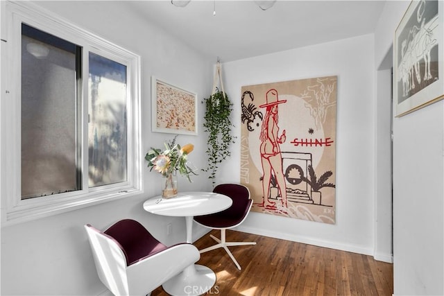 sitting room with dark hardwood / wood-style flooring