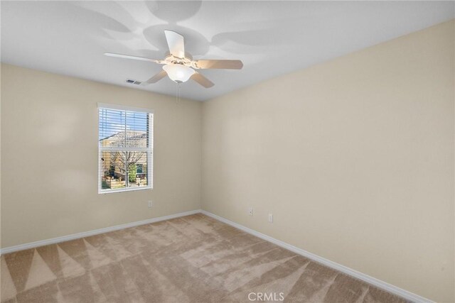 spare room with light colored carpet