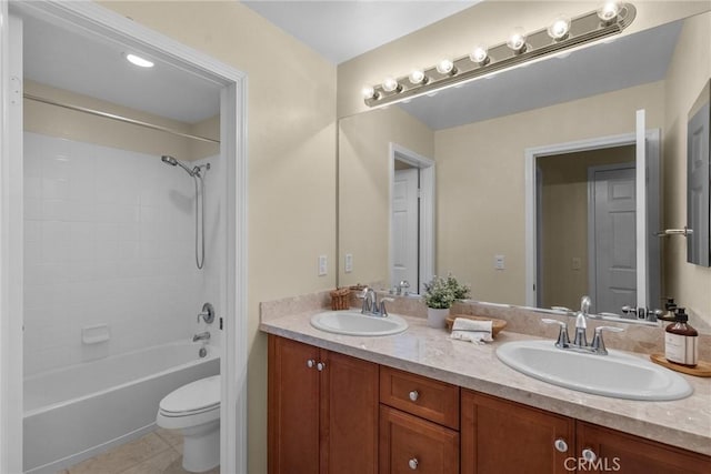 full bathroom featuring tile patterned flooring, bathtub / shower combination, vanity, and toilet