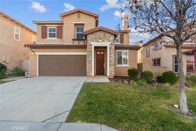 mediterranean / spanish-style home with stucco siding, concrete driveway, a front yard, a garage, and stone siding