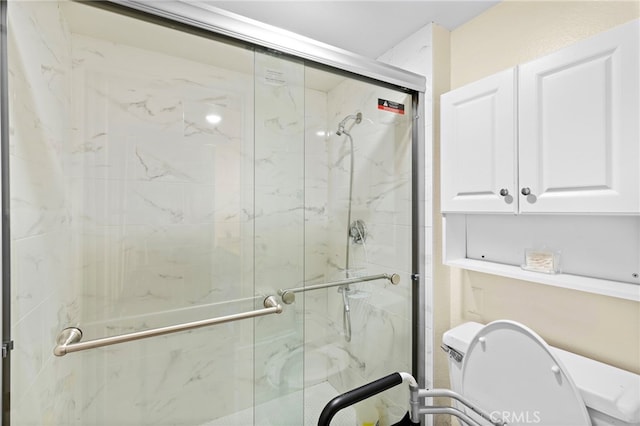 bathroom featuring an enclosed shower