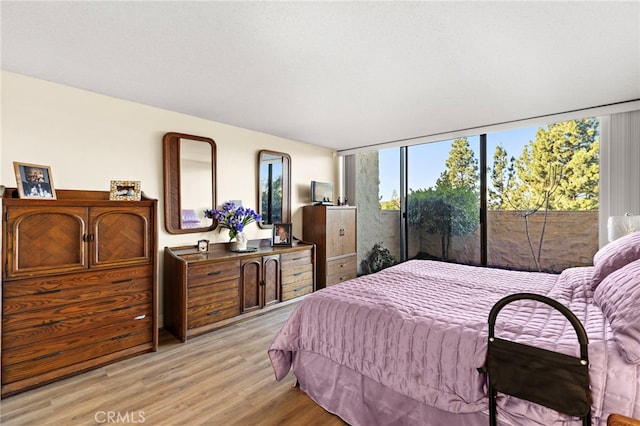 24055 Paseo Del Lago Unit 103, Laguna Woods, CA 92637 - bedroom featuring wood finished floors
