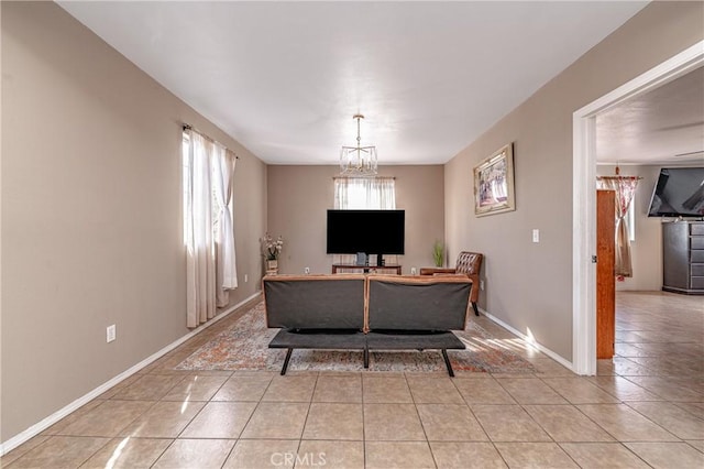 interior space with light tile patterned flooring and a chandelier