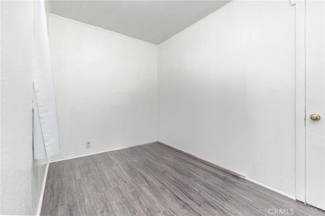 spare room with dark hardwood / wood-style floors