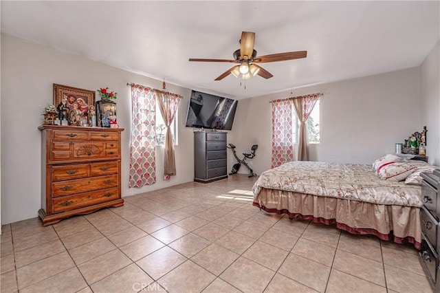 tiled bedroom with multiple windows and ceiling fan