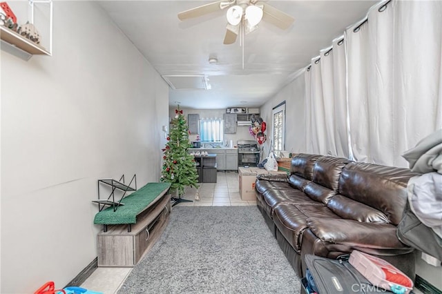 tiled living room featuring ceiling fan