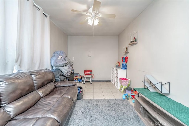 tiled living room with ceiling fan