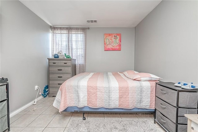 bedroom with light tile patterned floors