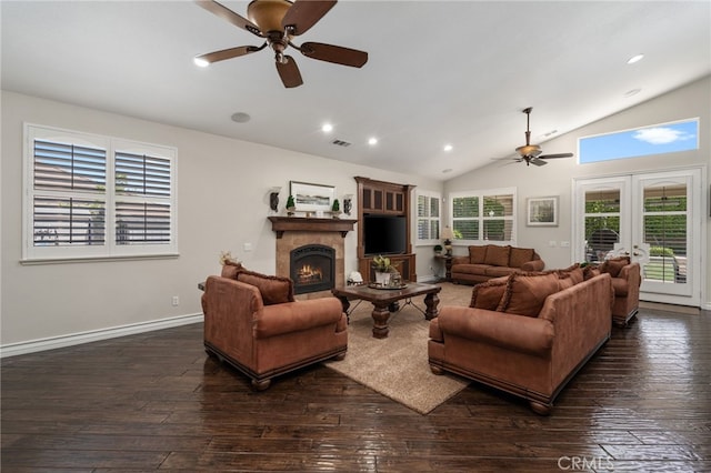 living room featuring french doors, ceiling fan, vaulted ceiling, and dark wood-type flooring