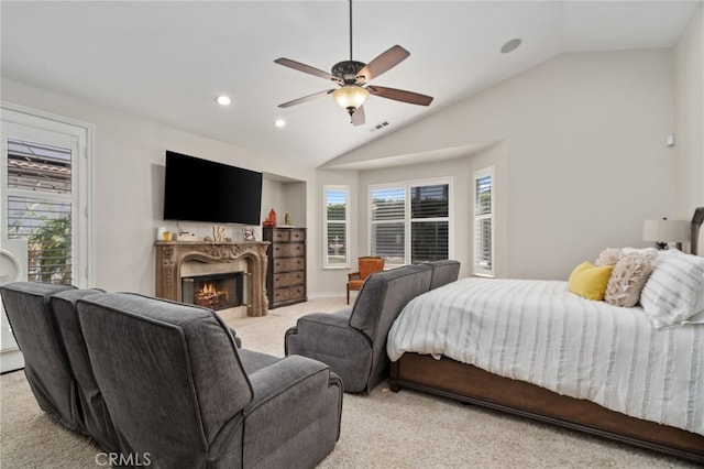 carpeted bedroom with lofted ceiling and ceiling fan