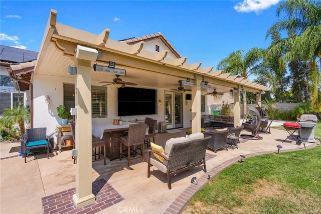 view of patio featuring a bar, ceiling fan, and outdoor lounge area