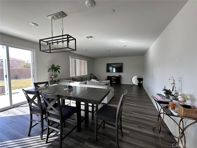 dining area with dark wood-type flooring