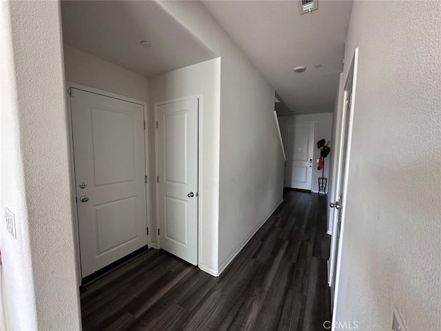 hall with dark hardwood / wood-style floors