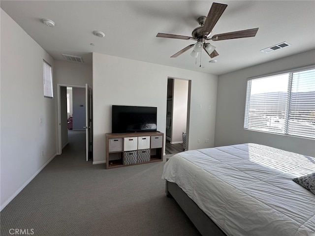 bedroom featuring ceiling fan and carpet