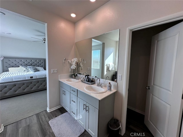 bathroom featuring vanity, hardwood / wood-style floors, and ceiling fan