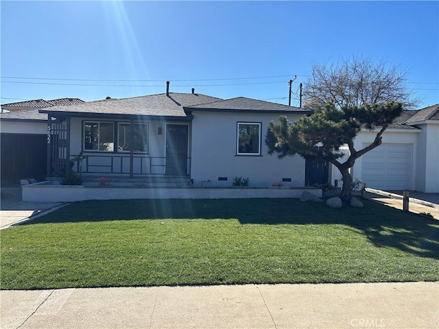 view of front facade with a garage and a front lawn