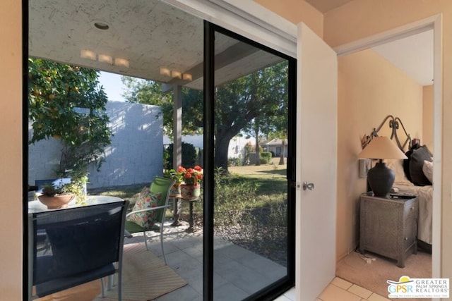 doorway with light tile patterned floors