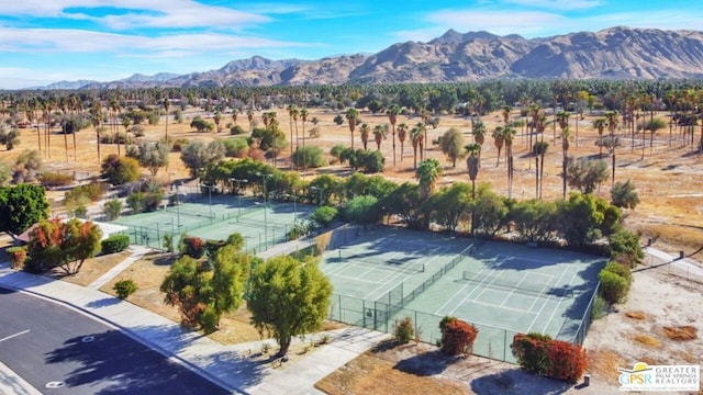 birds eye view of property with a mountain view