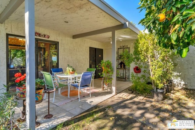 view of patio featuring ceiling fan