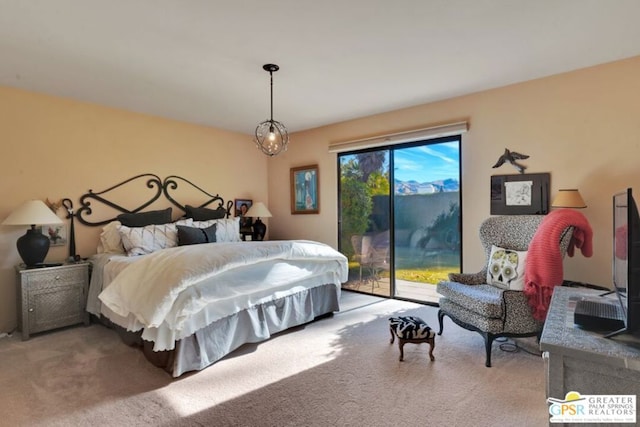 bedroom featuring access to outside and carpet flooring