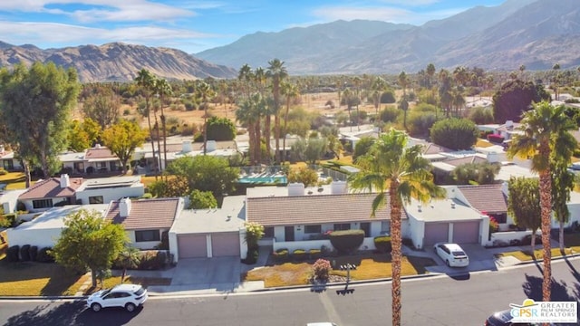 drone / aerial view featuring a mountain view