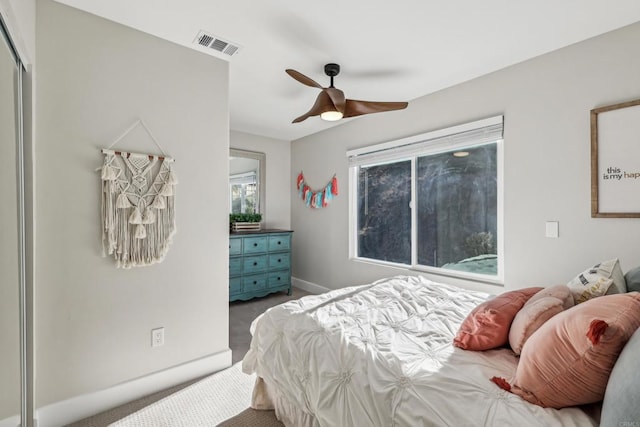 carpeted bedroom with ceiling fan