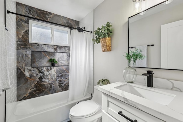 full bathroom featuring toilet, shower / bath combo, and vanity