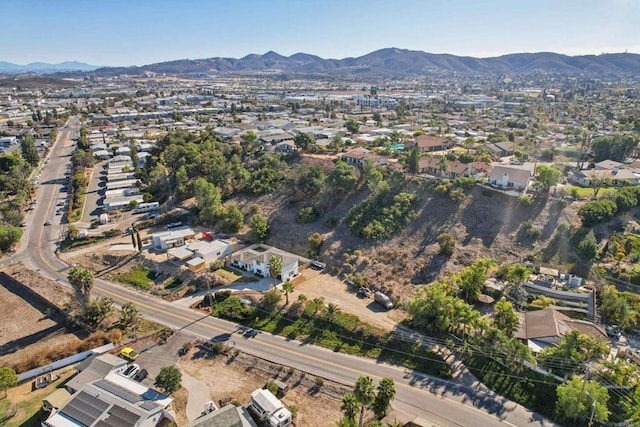 birds eye view of property featuring a mountain view