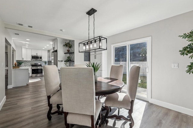 dining room featuring dark wood-type flooring