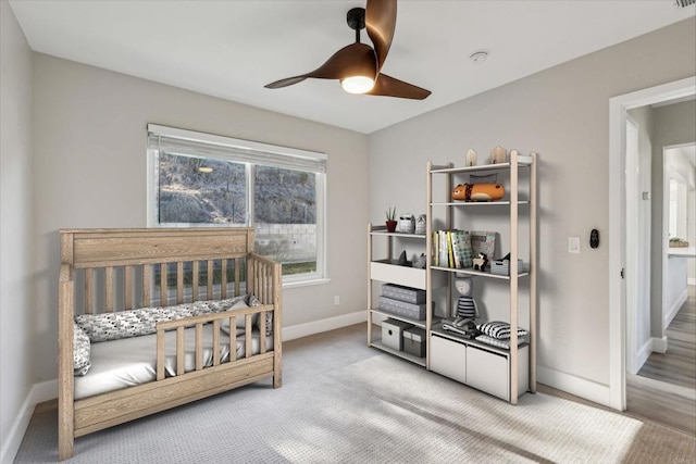 carpeted bedroom featuring ceiling fan